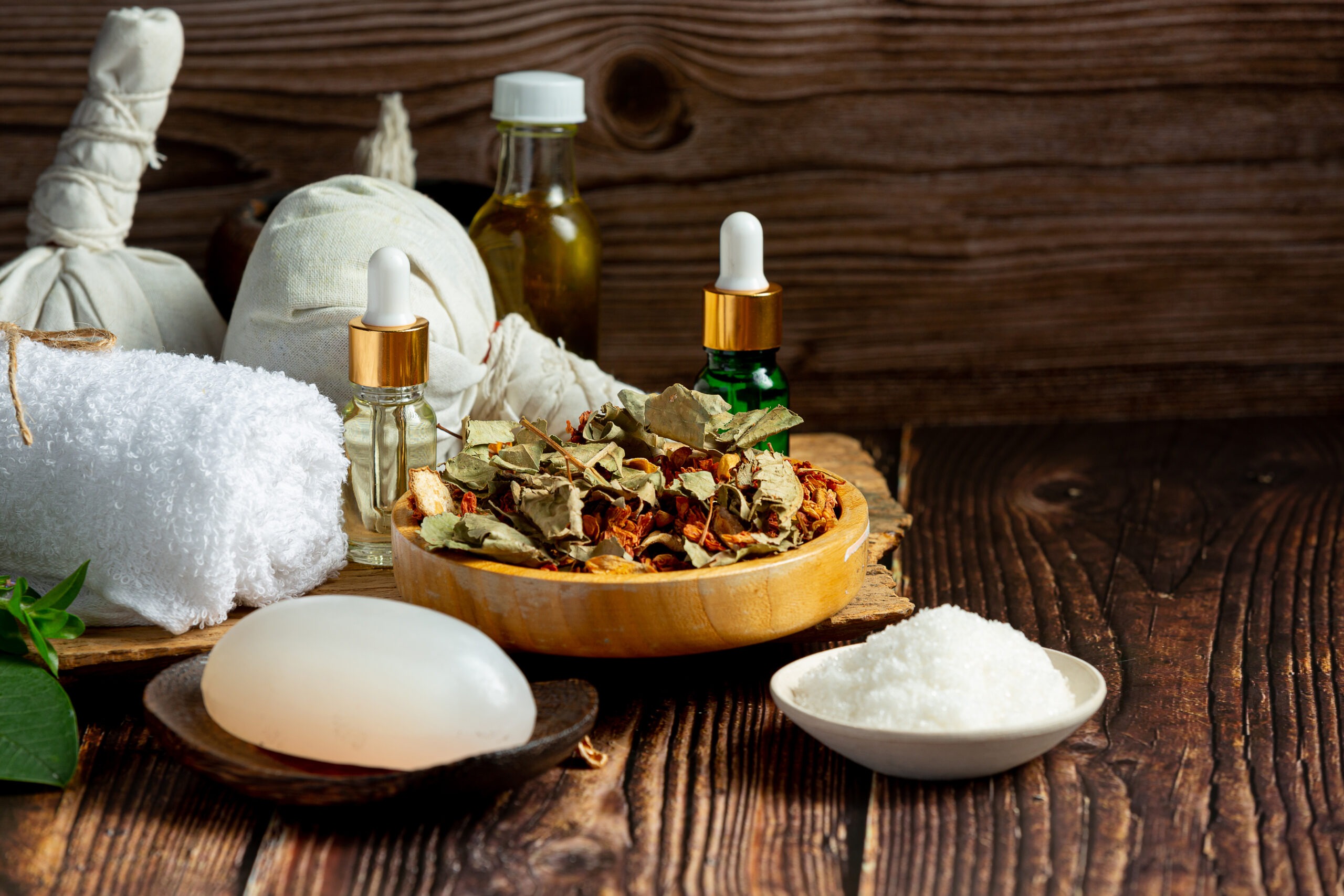 herbal spa treatment equipments put on wooden floor